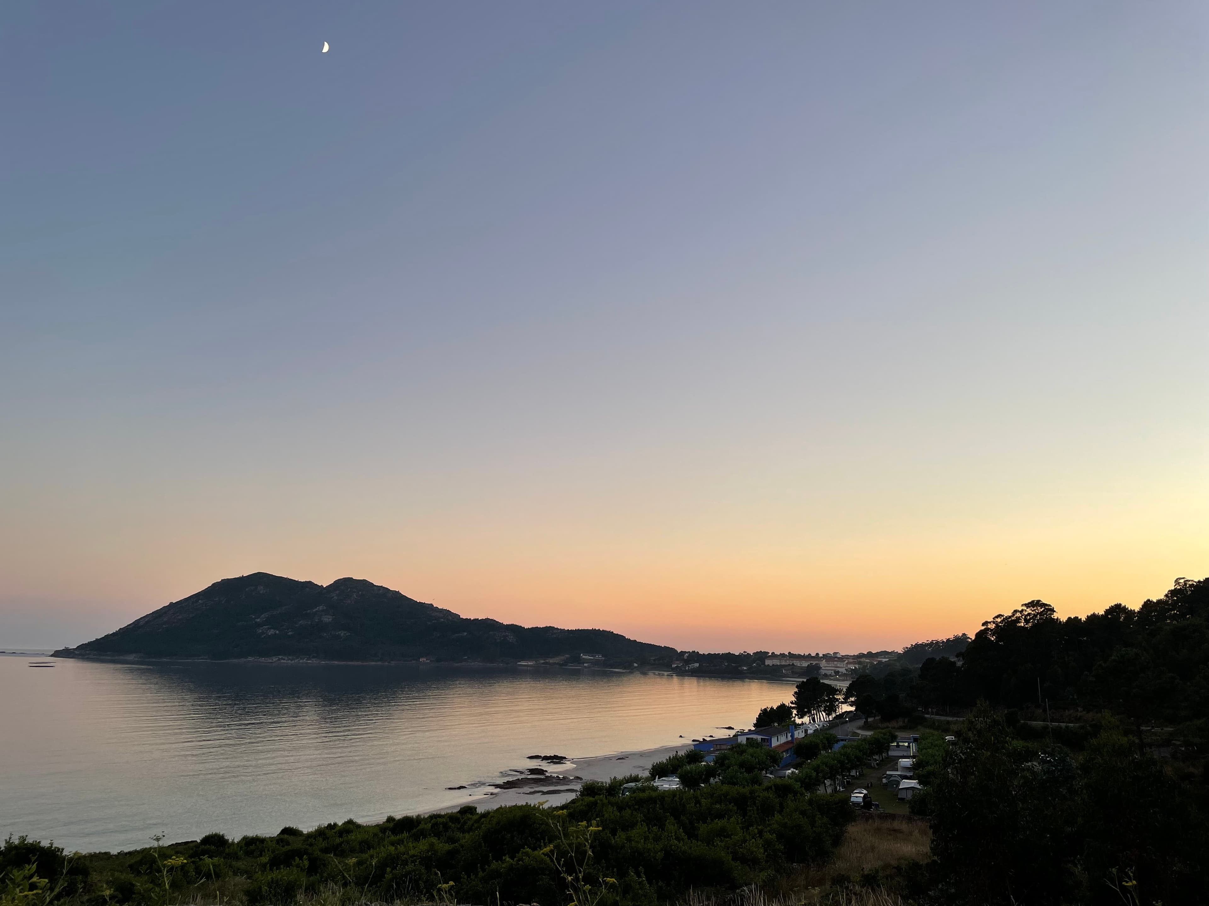 Monte Louro at dusk reflected over the Atlantic ría near Muros